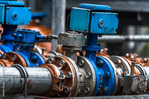 Close up of pipes and connections in a factory.