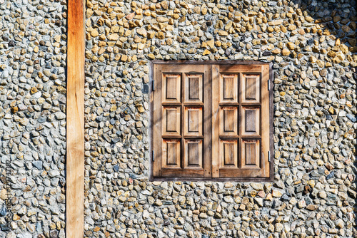 Masonry stone wall with grunge wood window