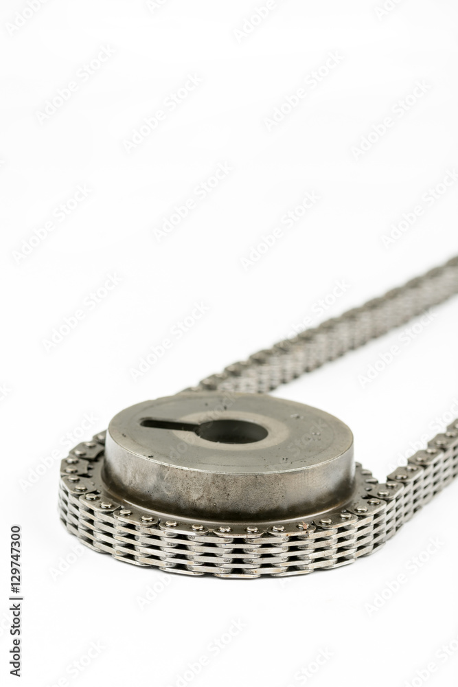 Closeup macro used oiled timing chain on cam shaft Closeup macro used oiled timing chain on cam shaft