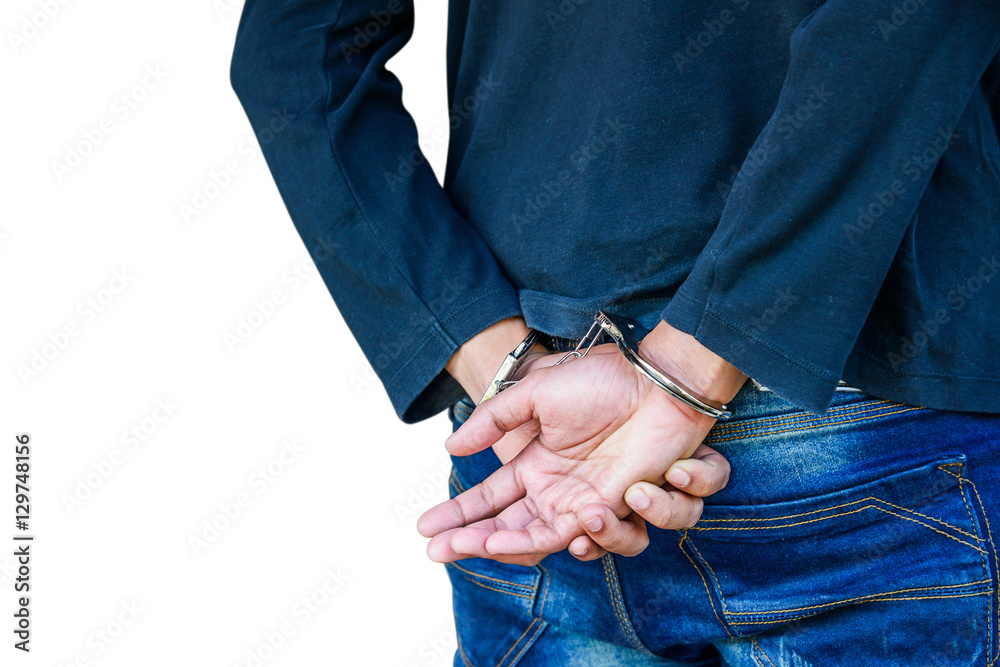 Male hands locked in handcuffs, With clipping path.