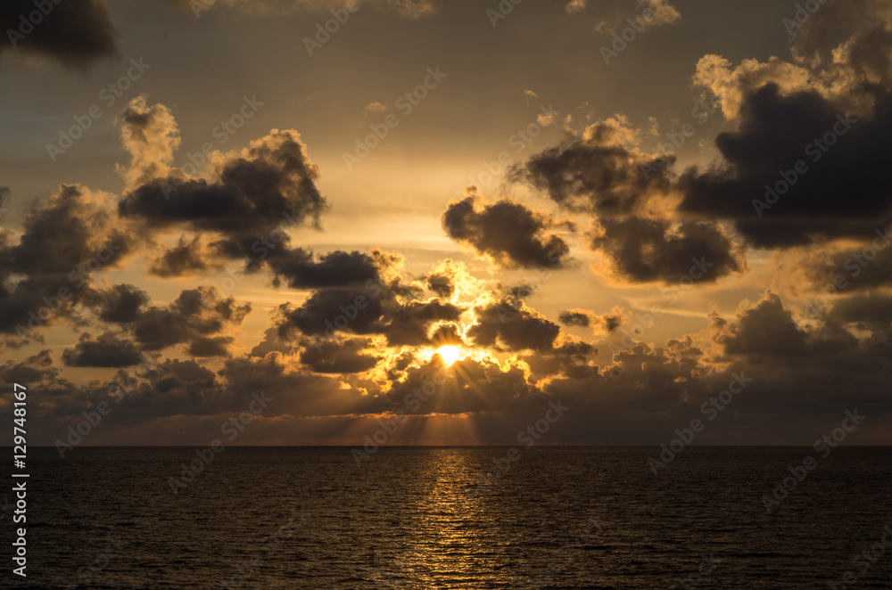 Sunset over sea. Gold picture sea sunset. Amazing sea sunset background. Sunset sea picture.