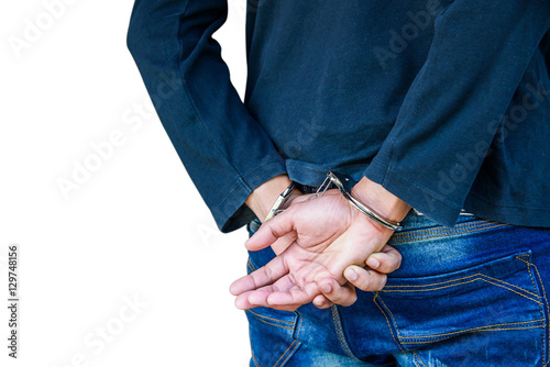 Male hands locked in handcuffs, With clipping path.