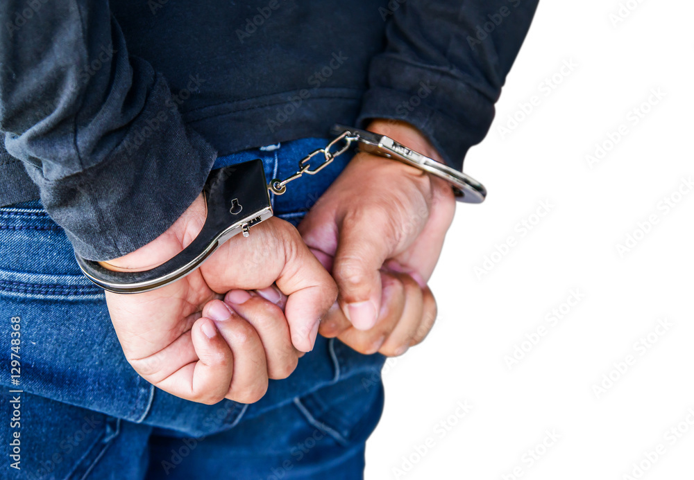 Male hands locked in handcuffs on white, With Clipping Path..