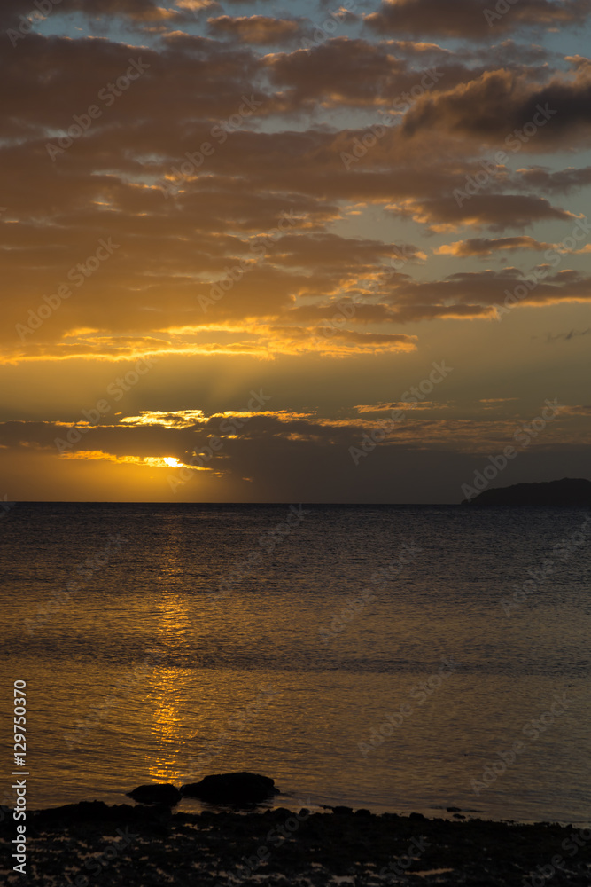 Fototapeta premium Golden sunset over ocean . Sky Fiji