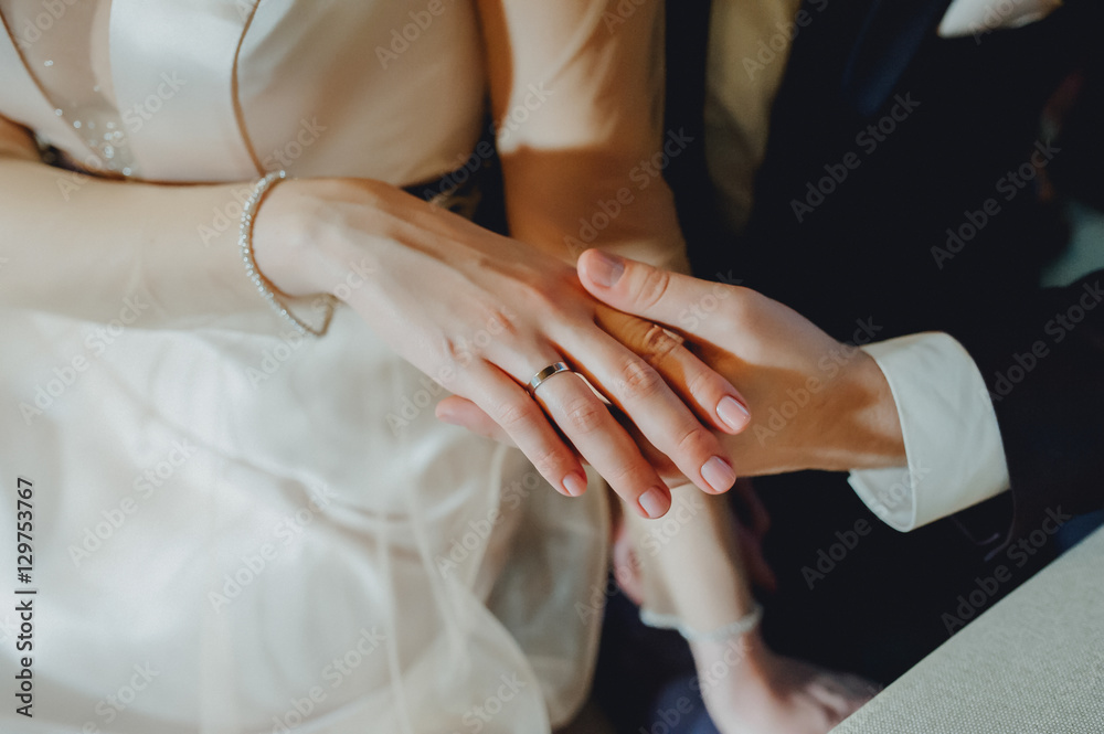 Bride hand in groom  on a romantic date