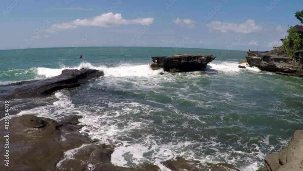 View of waves beat against rocks on seashore View of waves beat against rocks on seashore