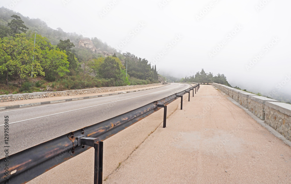 road in the mountains in the mist