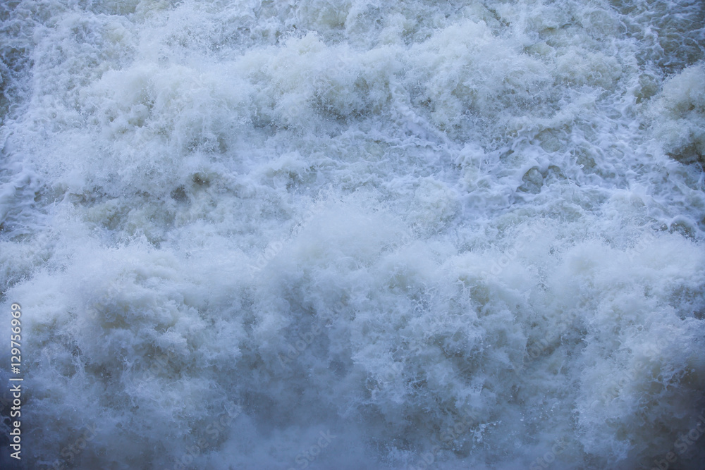 Water flowing from the open sluice gates of dam. Water flowing from the open sluice gates of dam.
