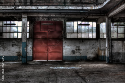 The red door of a garage for mine vehicles