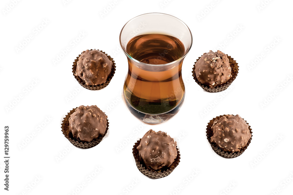 Glass with cognac and chocolate isolated on white background Glass with cognac and chocolate isolated on white background