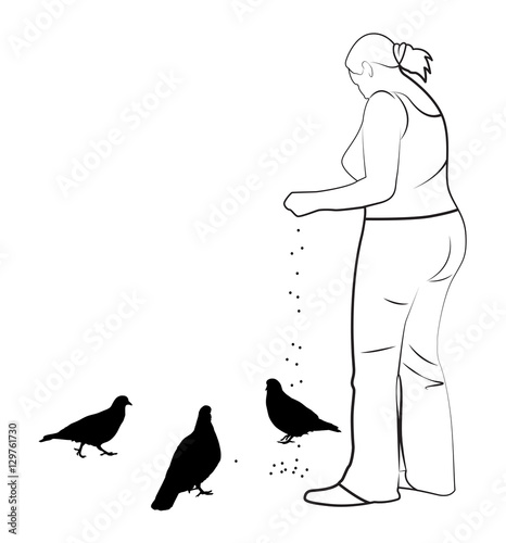 The girl feeds pigeons
