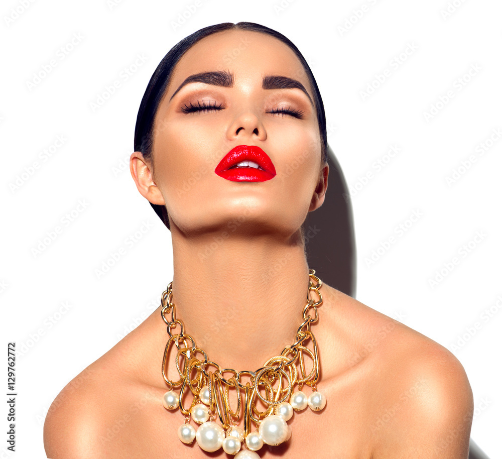 Beauty fashion model brunette girl portrait. Sexy young woman with perfect makeup and trendy golden accessories