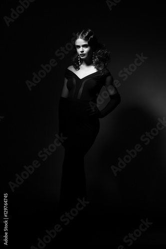 full length beauty portrait of woman in retro style. Add noise a photo