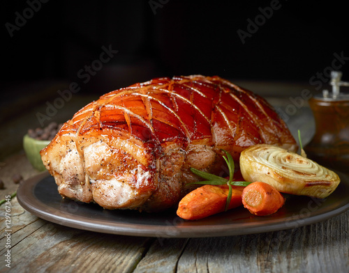 roasted pork on dark plate