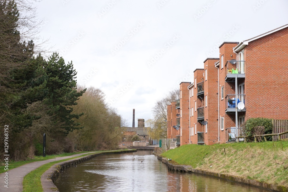 A small block of flats alongside a canal in an mixed industrial and residential area of Middleport, Stoke-on-Trent