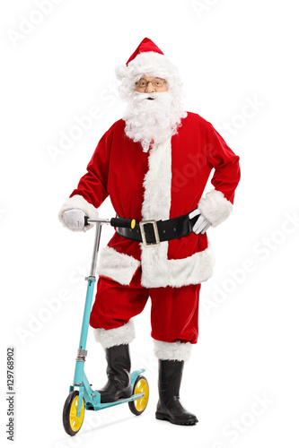 Santa claus posing with a scooter