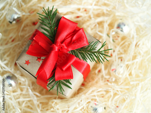 Christmas gift with raffia. Congratulations to the new year, gift presentation.