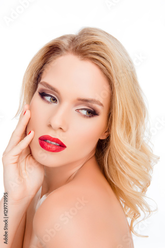 Young beautiful sexy blonde with stylish make-up and hairdo touc