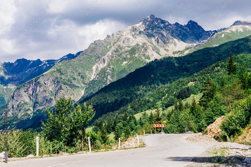 Road with rocky mountains in Caucasus Mountains, Svaneti, Georgia