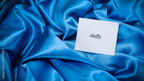 Obraz na plátně blue silk cloth, a note on the paper