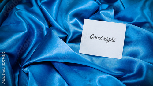 Fotografie blue silk cloth, a note on the paper