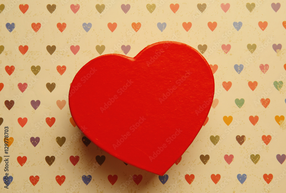 Heart shaped gift box on color background