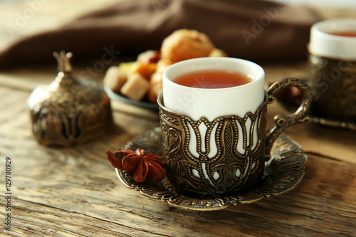 Fresh tea composition on wooden background