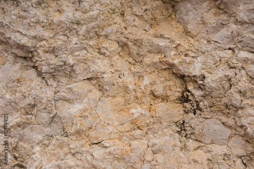 Background quarried rough textured limestone rock