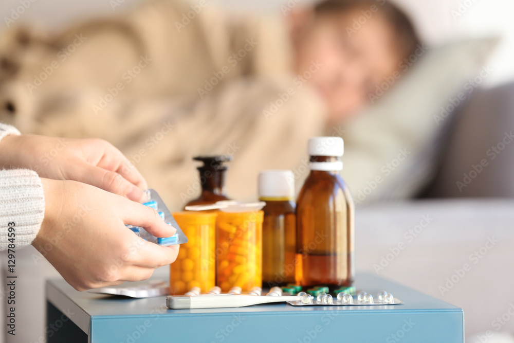 Woman taking care of small sick boy Woman taking care of small sick boy