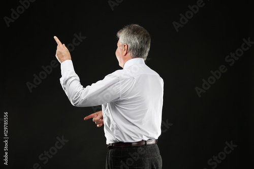 Senior businessman standing...