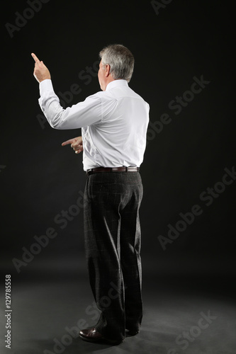 Senior businessman standing...