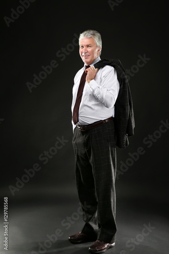 Senior businessman on white...