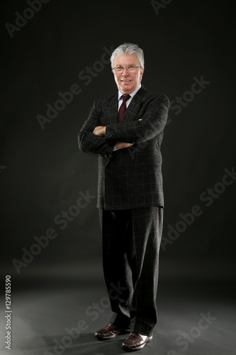 Senior businessman on black...