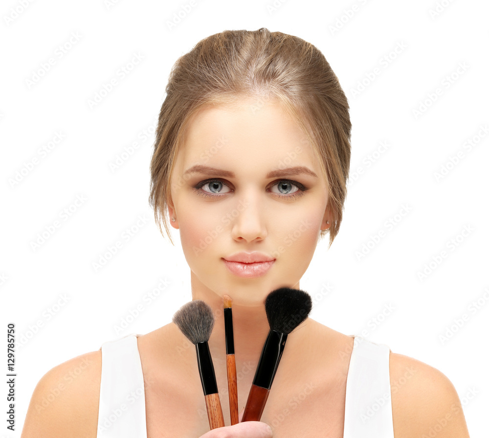 Applying Make-up. Woman with a brush for make-up Applying Make-up. Woman with a brush for make-up