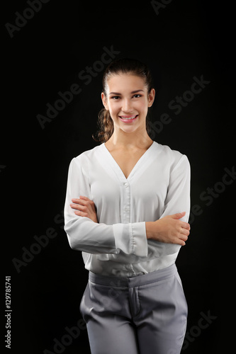 Young businesswoman on blac...