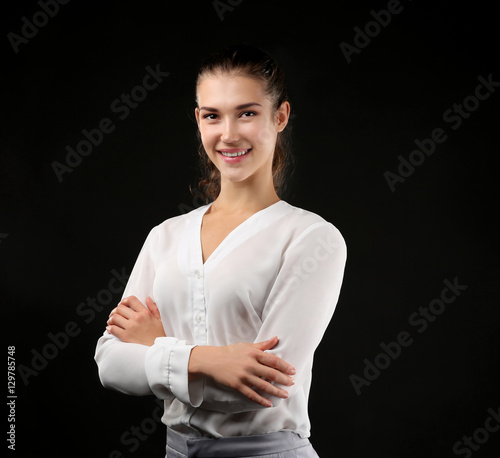 Young businesswoman on blac...