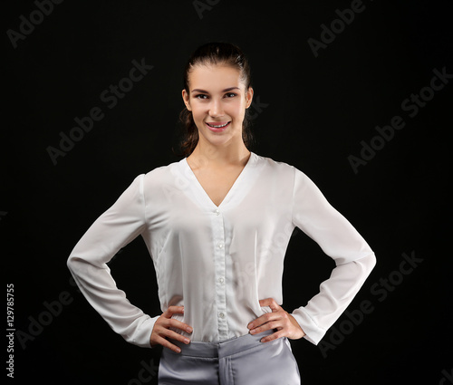Young businesswoman on blac...