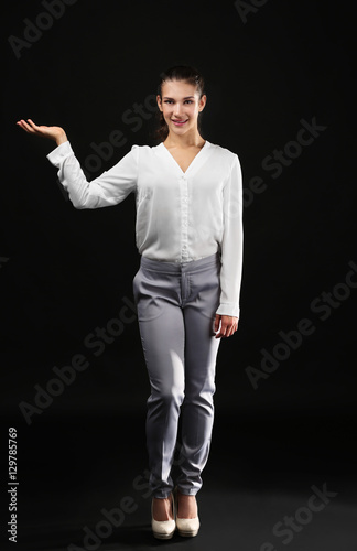 Young businesswoman on blac...