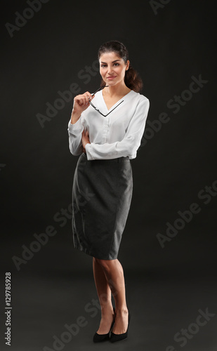 Young businesswoman on blac...