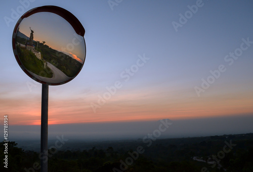 Road Corner Mirror on a beautiful sunset sky