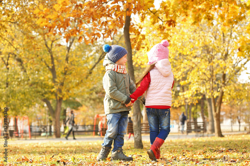 Group of children having fun walking in park Group of children having fun walking in park