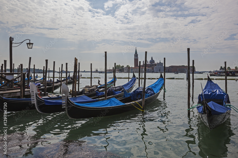 Venetian gondolas anchored in the lagoon