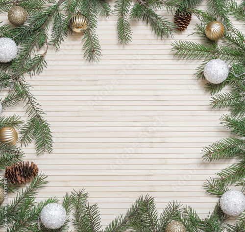 Christmas wooden background decorated fir branches and toys