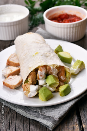 Fajitas with chicken meat and avocado