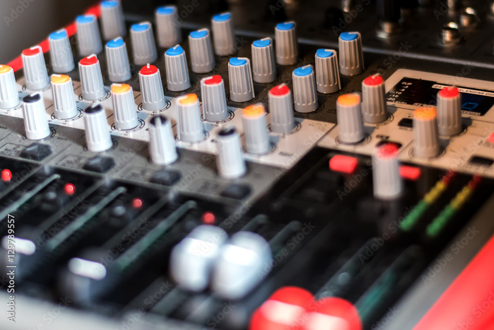 close up electronic professional sound mixer control panel in mu