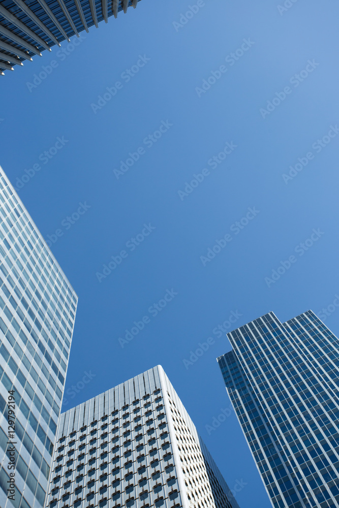 Skyscrapers with glass facade. Modern buildings in Paris business district. Concepts of economics, financial, future.  Copy space for text. Dynamic composition. Toned