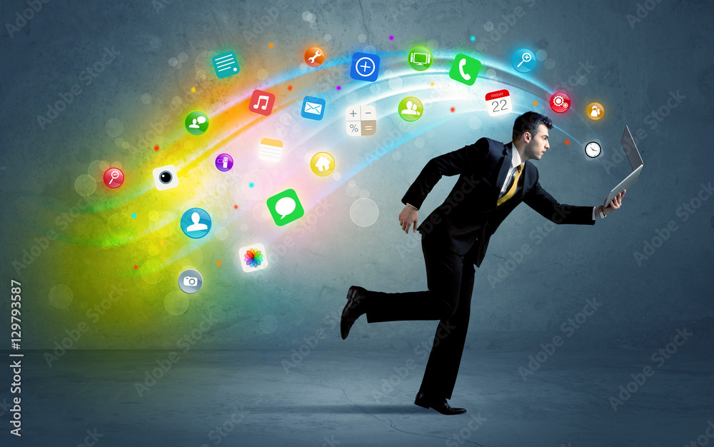 Running businessman with application icons from device Running businessman with application icons from device