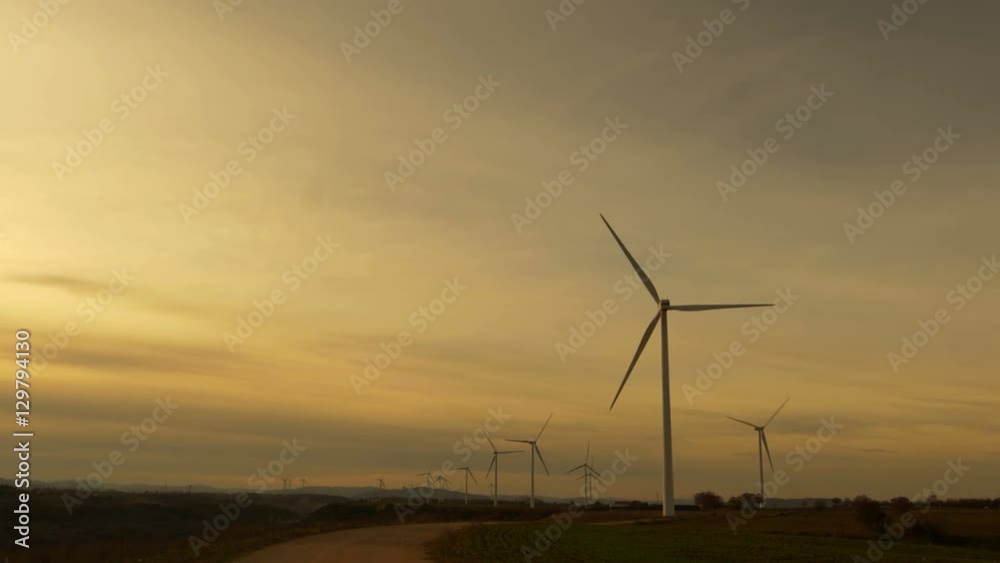 sunset on a wind turbine producing green electricity sunset on a wind turbine producing green electricity