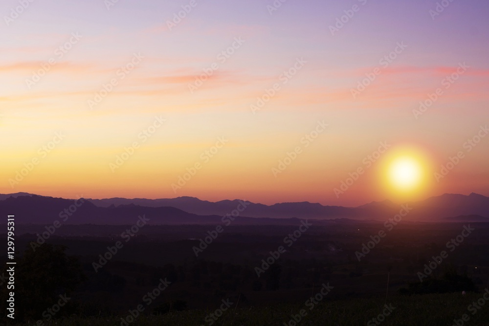 Beautiful silhouette landscape and sunset at night on a meadow on early winter at moon