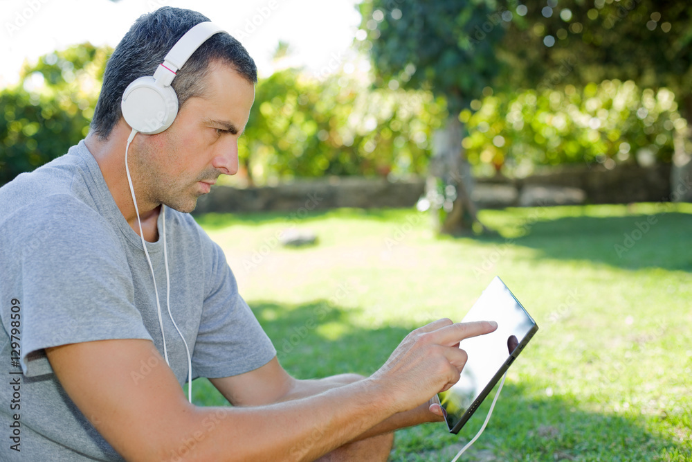 man relaxing with tablet pc